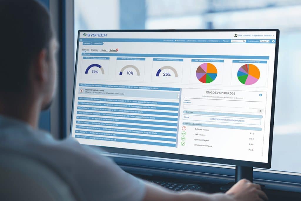 Manufacturing manager at computer screen monitoring packaging serialization operations.